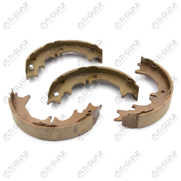 Тормозные колодки (КОМПЛЕКТ 4шт/РУЧНОГО ТОРМОЗА) TG-46580-60060/FN0642* Ti·GUAR Тормозные колодки (КОМПЛЕКТ 4шт/РУЧНОГО ТОРМОЗА) TG-46580-60060/FN0642* Ti·GUAR